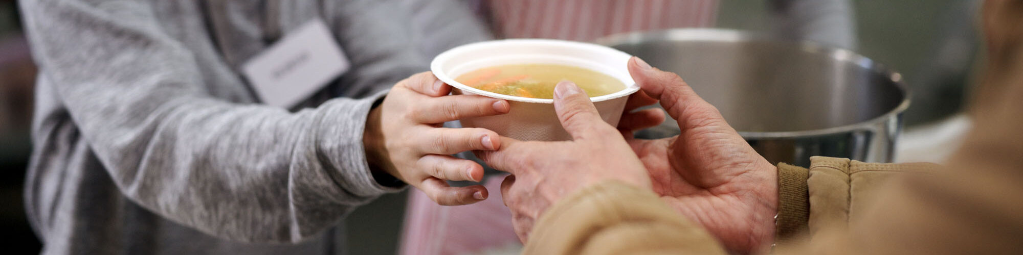 Volunteers,Serving,Hot,Soup,For,Homeless,In,Community,Charity,Donation